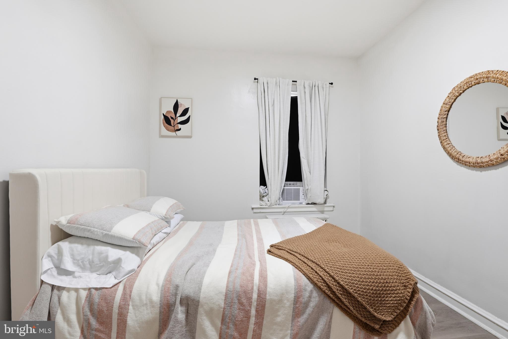 831 North 10th Street Reading, PA 19604 - Photo 29 of 33 a bedroom with a bed and a chair