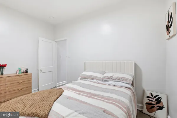 a bedroom with a bed and a cabinets