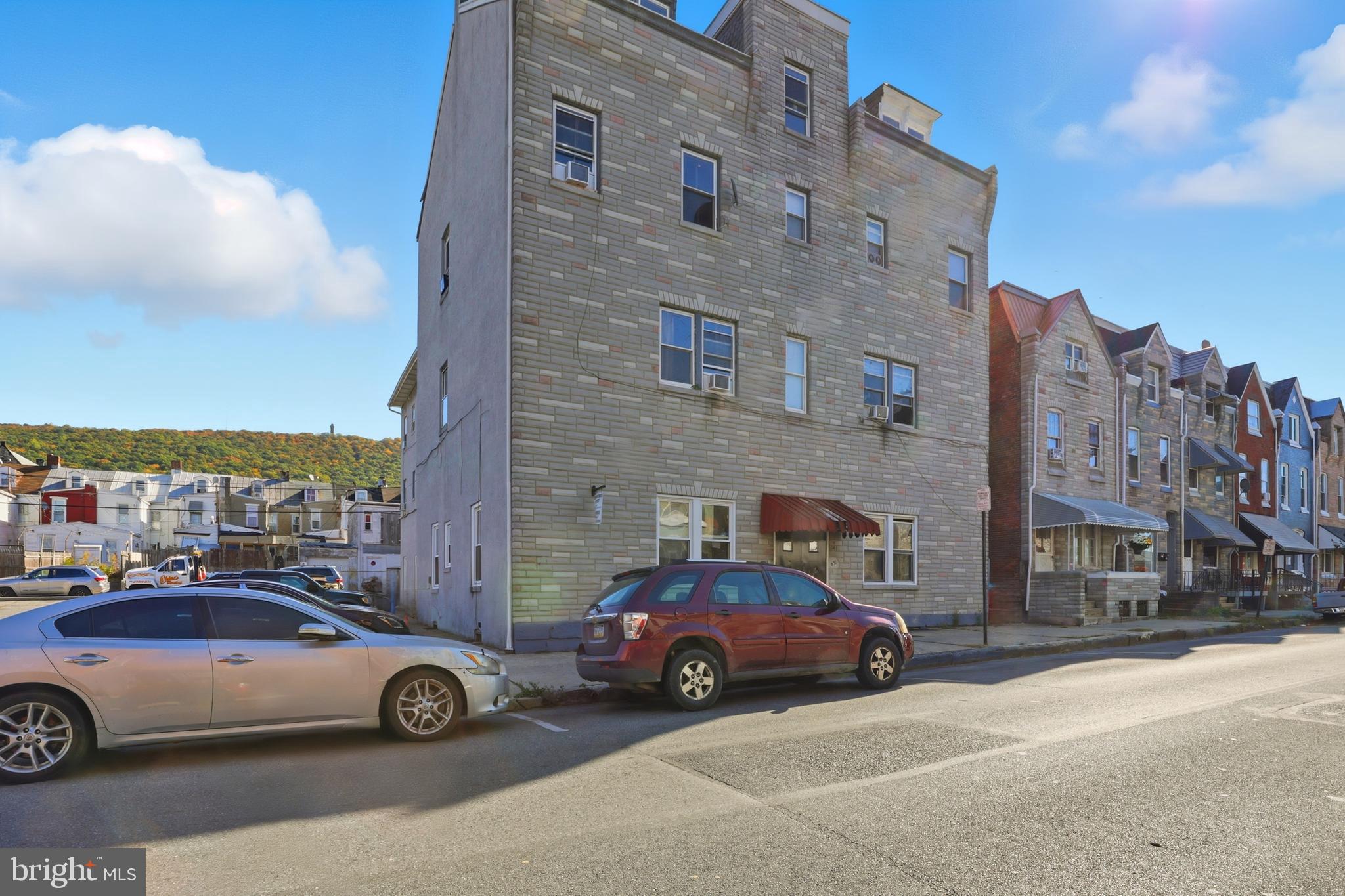 831 North 10th Street Reading, PA 19604 - Photo 3 of 33 a view of a cars parked in front of a building