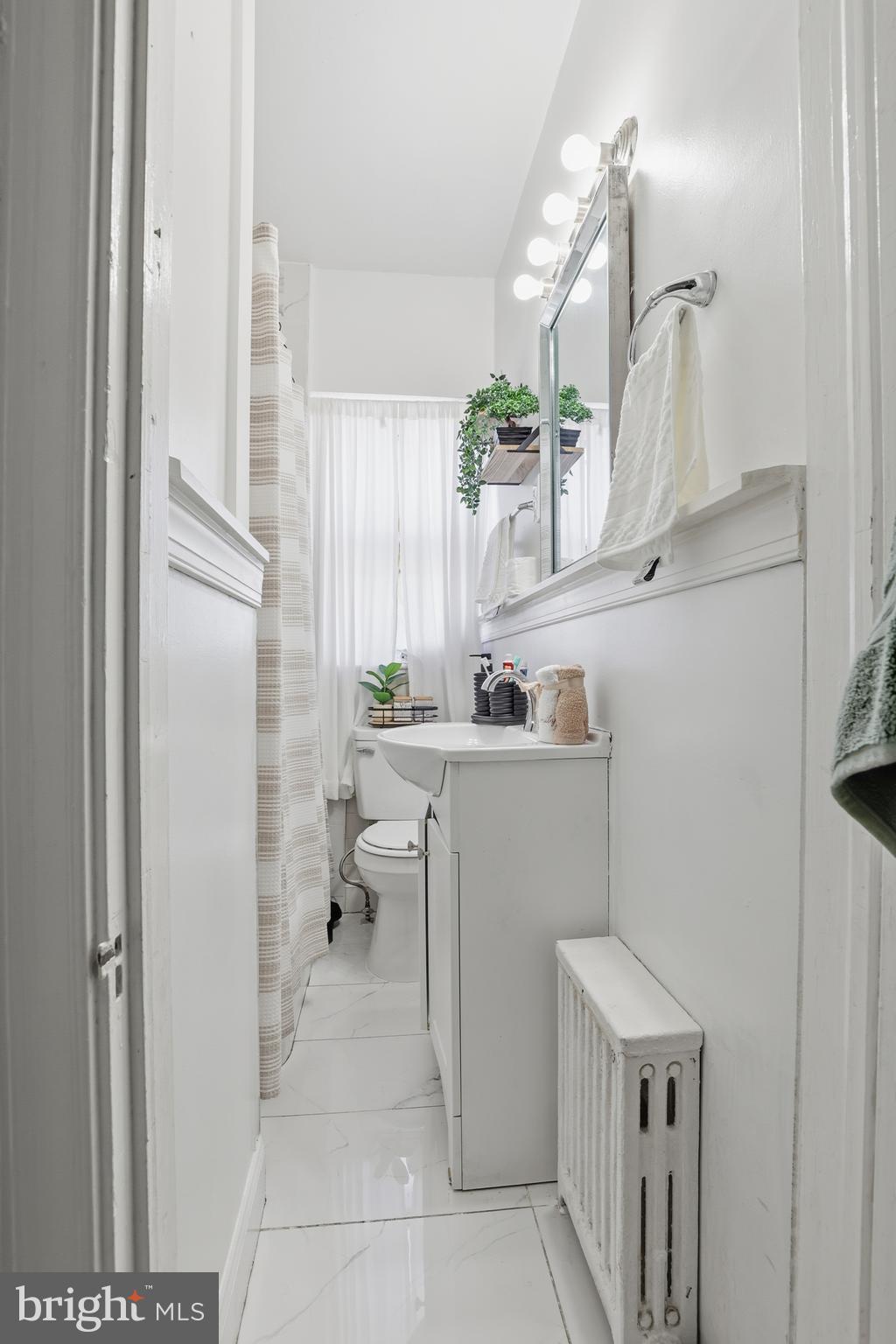831 North 10th Street Reading, PA 19604 - Photo 32 of 33 a bathroom with a sink a toilet and shower