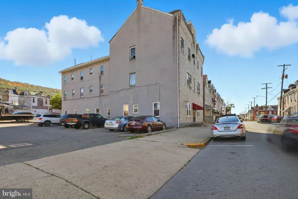 a cars parked in front of a building