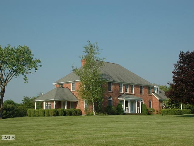 7 Hussars Camp Place Ridgefield, CT 06877 - Photo 1 of 1 a front view of a house with a yard