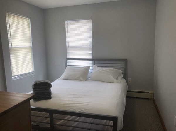 138 Ferry Street, Unit 2 Everett, MA 02149 - Photo 16 of 18 a bedroom with a bed and a window