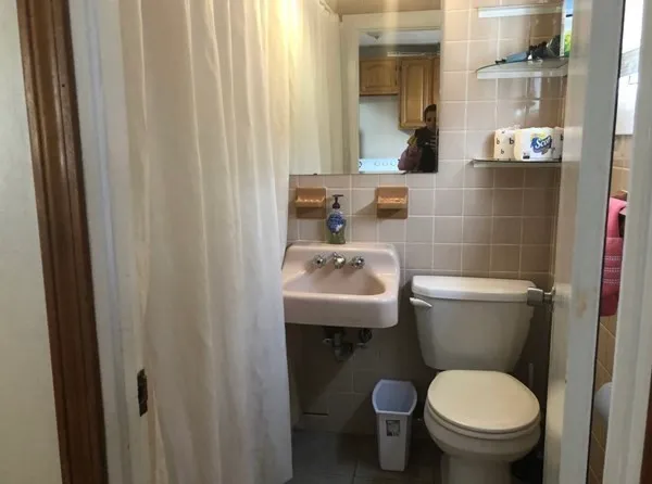 a bathroom with a toilet and a sink
