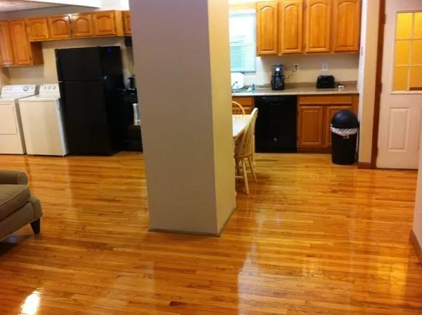 a kitchen with stainless steel appliances a refrigerator and a stove