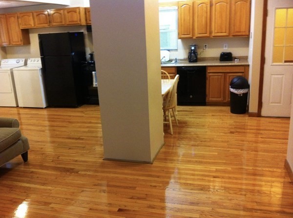 138 Ferry Street, Unit 2 Everett, MA 02149 - Photo 5 of 18 a kitchen with stainless steel appliances a refrigerator and a stove