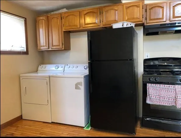 a utility room with closet dryer and washer