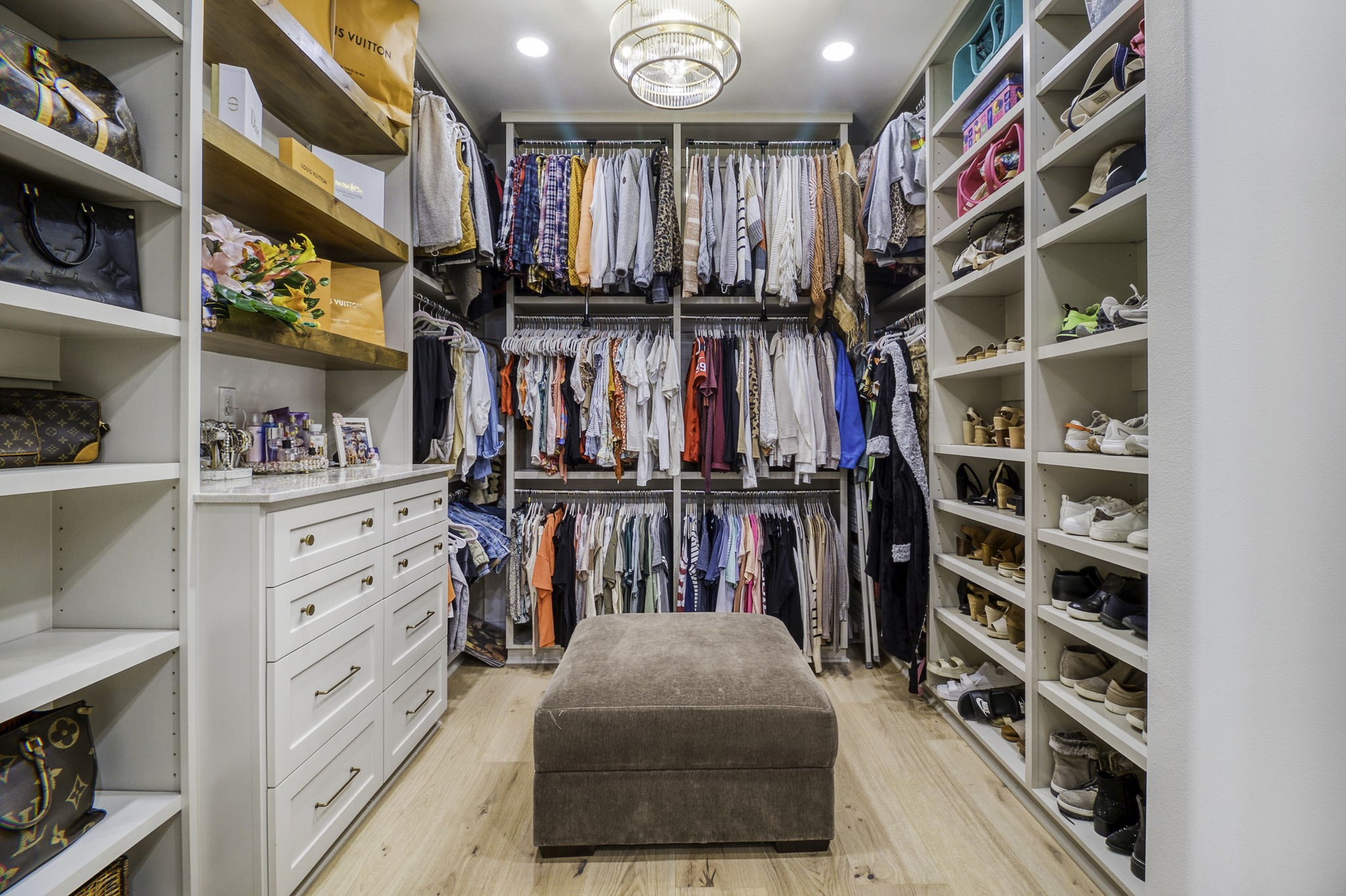 4602 Fm 3459 Road Onalaska, TX 77360 - Photo 26 of 45 a view of walk in closet with clothes and shoes