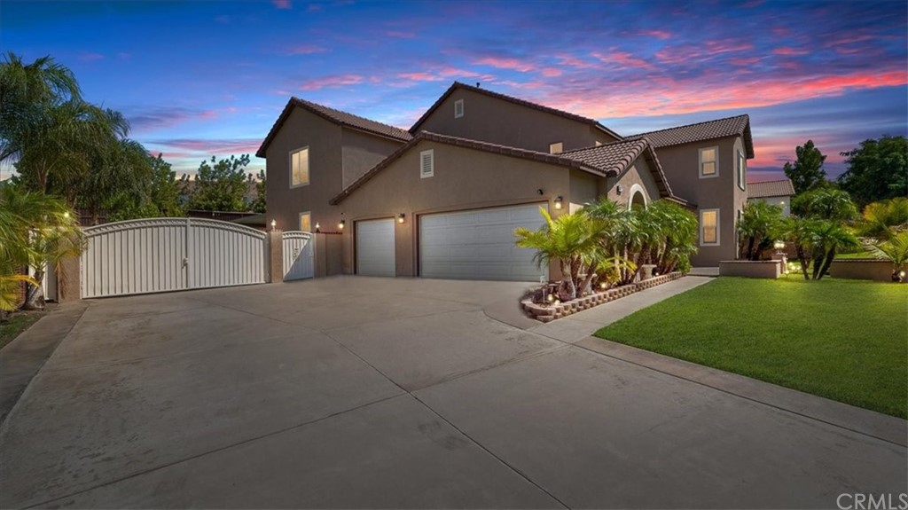 8872 Windmill Place Riverside, CA 92508 - Photo 1 of 1 a front view of a house with a yard and garage