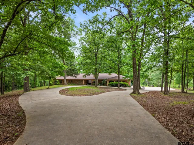 a backyard of a house with barbeque oven