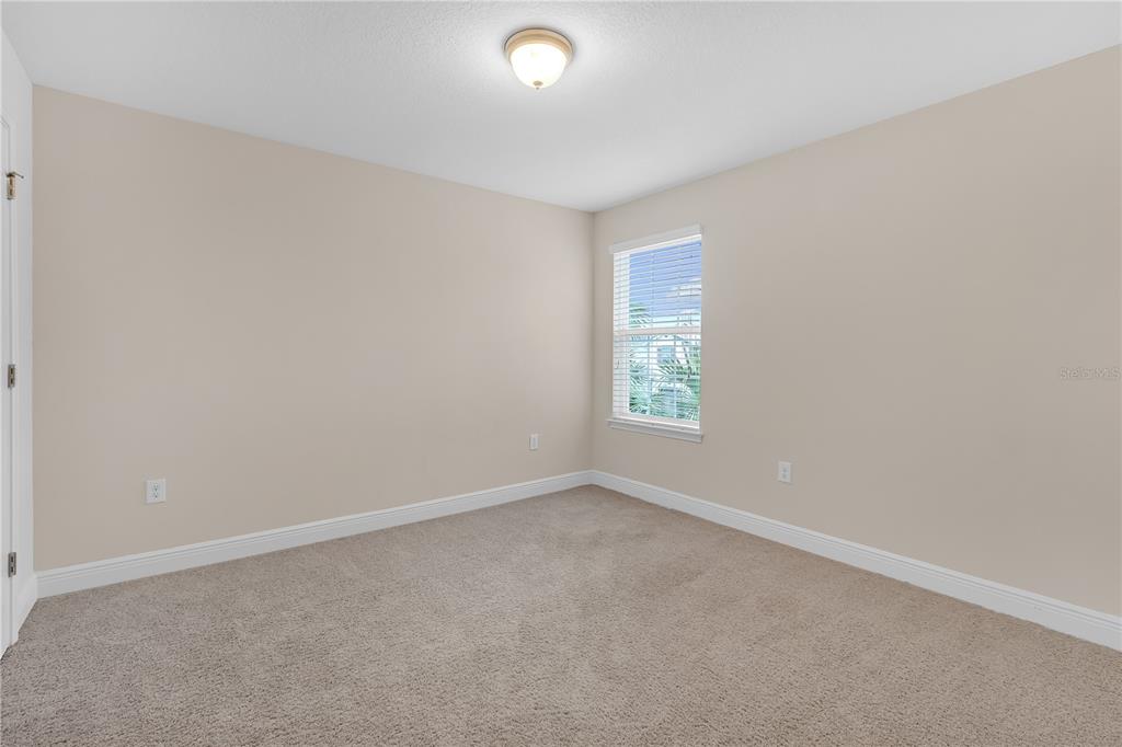 17841 Althea Blue Place Lutz, FL 33558 - Photo 25 of 38 an empty room with windows