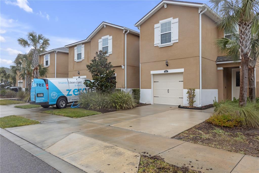 17841 Althea Blue Place Lutz, FL 33558 - Photo 3 of 38 a front view of a house with garden