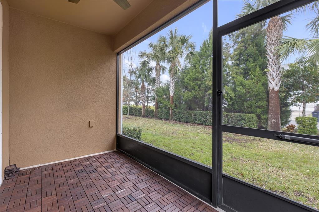 17841 Althea Blue Place Lutz, FL 33558 - Photo 33 of 38 a view of a room with wooden floor and outdoor space