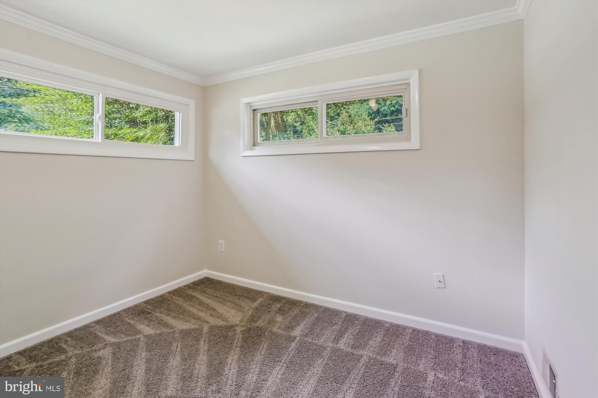 3909 Woodlawn Road Chevy Chase, MD 20815 - Photo 12 of 54 an empty room with windows