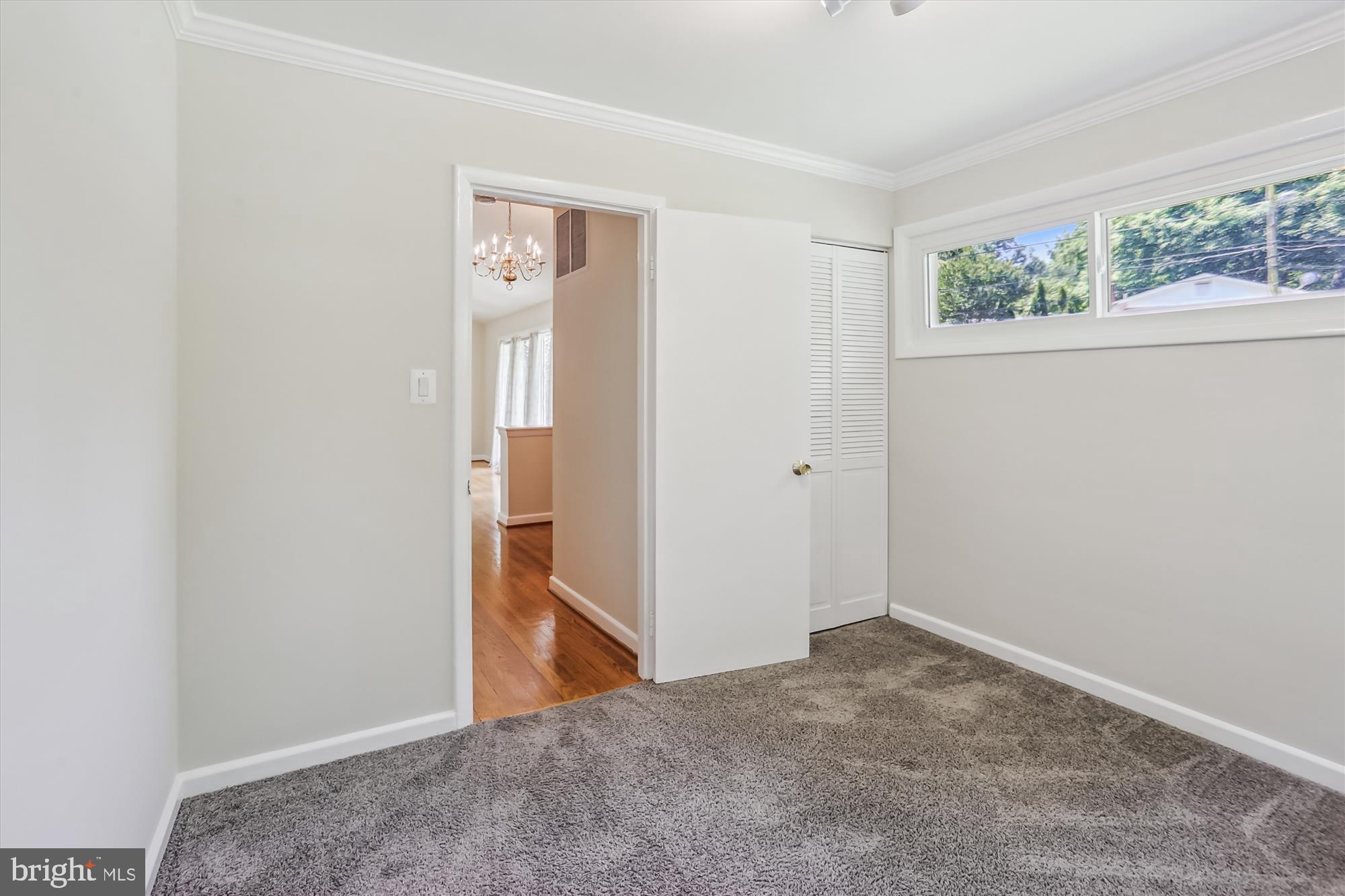 3909 Woodlawn Road Chevy Chase, MD 20815 - Photo 13 of 54 an empty room with windows and closet