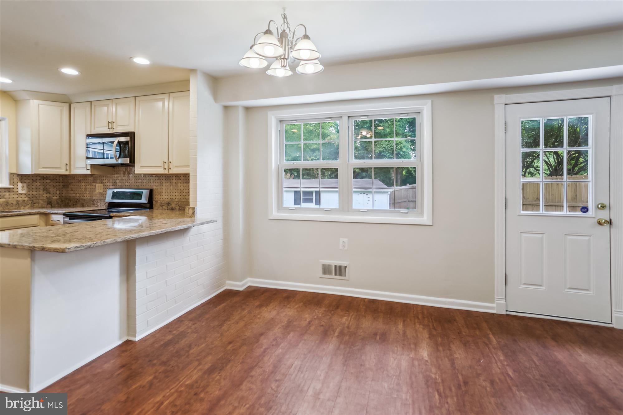 3909 Woodlawn Road Chevy Chase, MD 20815 - Photo 19 of 54 a view of a kitchen with microwave and cabinets
