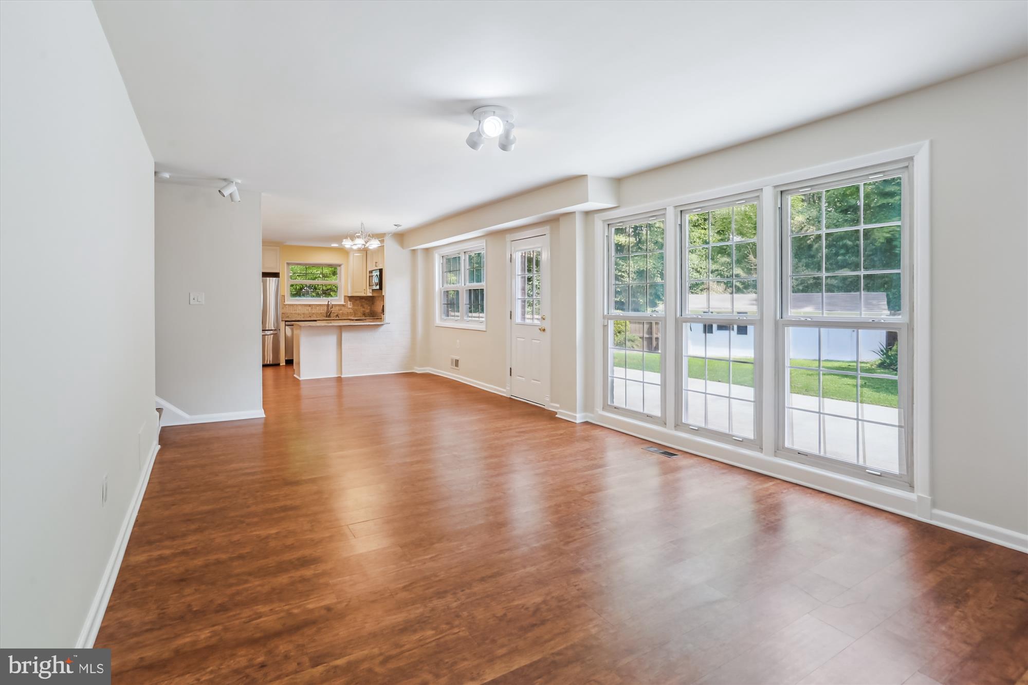 3909 Woodlawn Road Chevy Chase, MD 20815 - Photo 21 of 54 a view of an empty room with wooden floor and a window