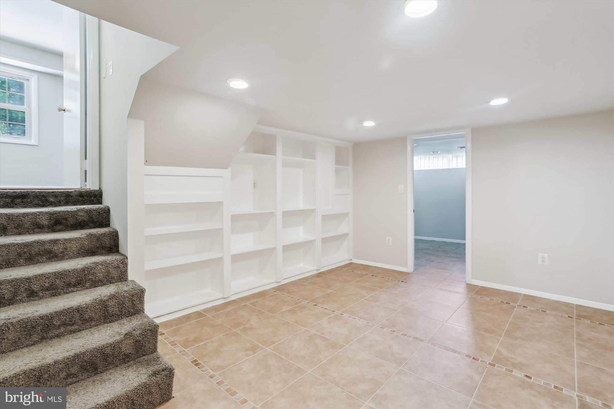 3909 Woodlawn Road Chevy Chase, MD 20815 - Photo 26 of 54 a view of an empty room with a staircase