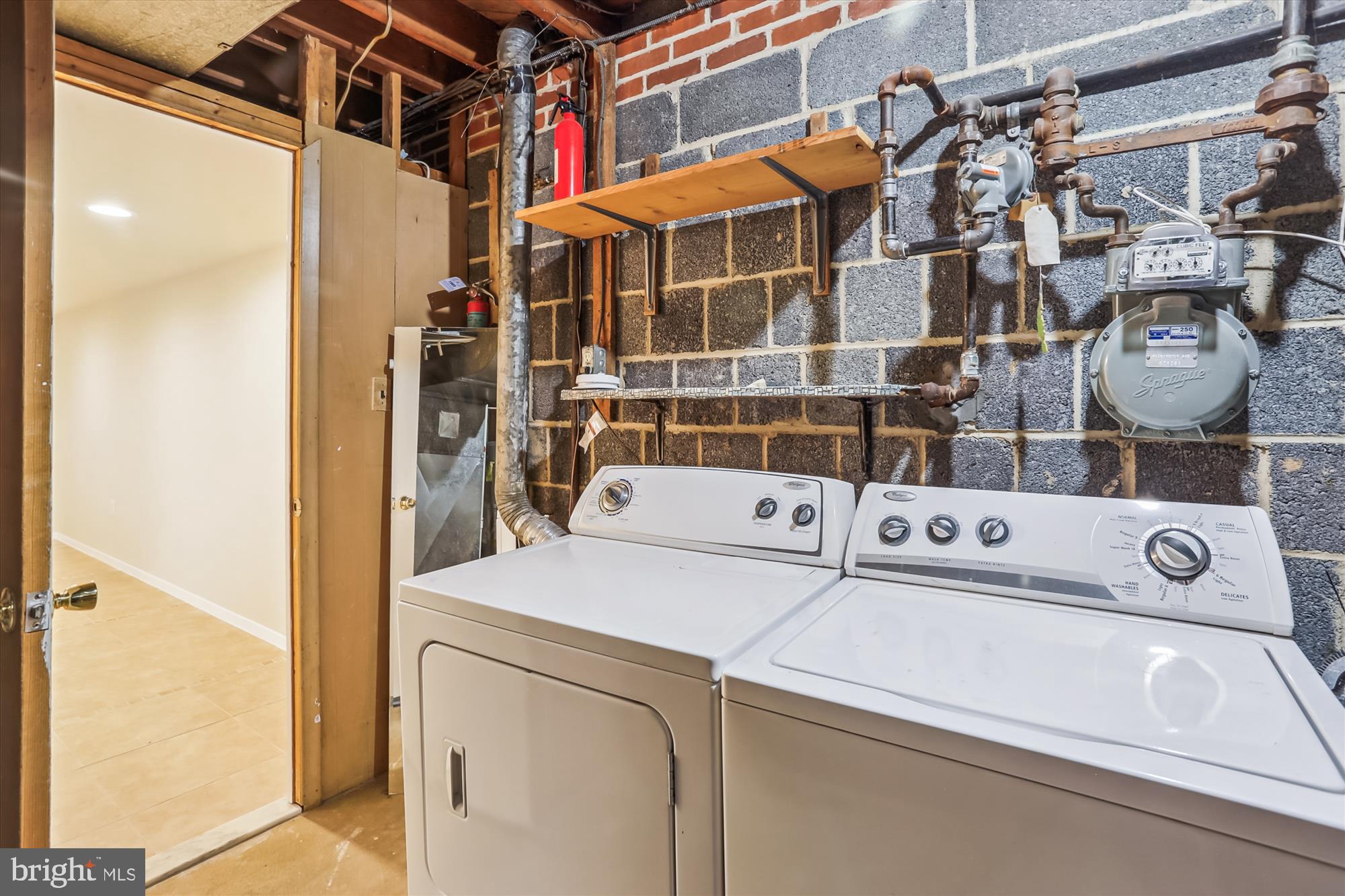 3909 Woodlawn Road Chevy Chase, MD 20815 - Photo 27 of 54 a utility room with dryer and washer