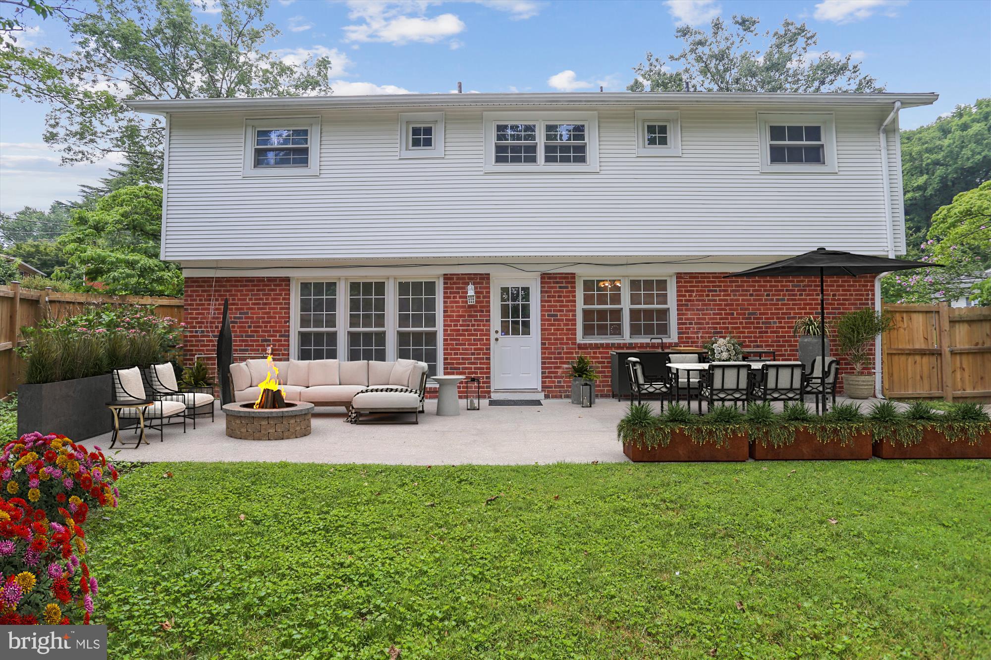3909 Woodlawn Road Chevy Chase, MD 20815 - Photo 29 of 54 a view of a house with backyard sitting area and garden