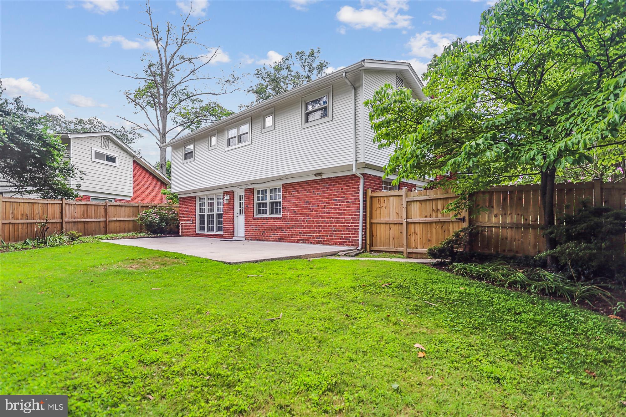 3909 Woodlawn Road Chevy Chase, MD 20815 - Photo 30 of 54 a view of a house with a yard plants and large tree