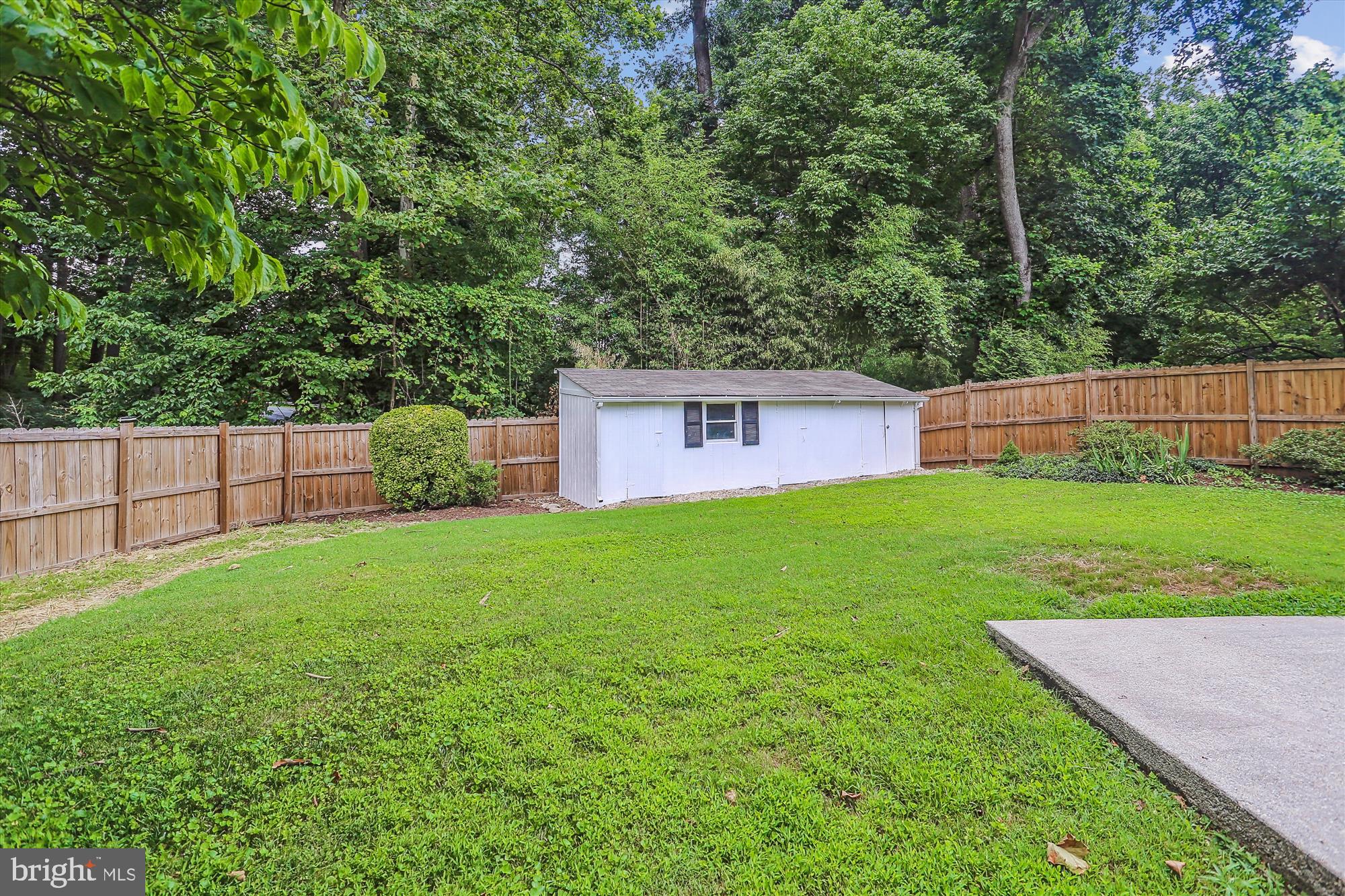 3909 Woodlawn Road Chevy Chase, MD 20815 - Photo 31 of 54 a view of a backyard with a small cabin