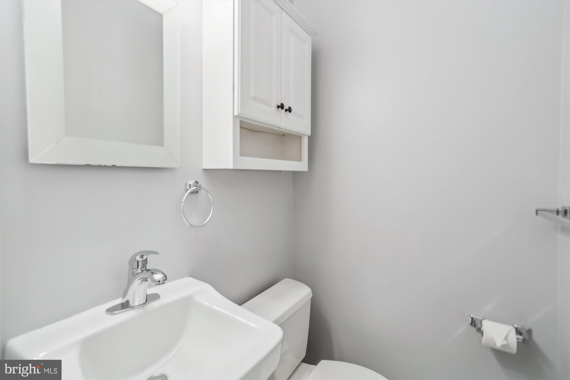3909 Woodlawn Road Chevy Chase, MD 20815 - Photo 9 of 54 a bathroom with a toilet sink