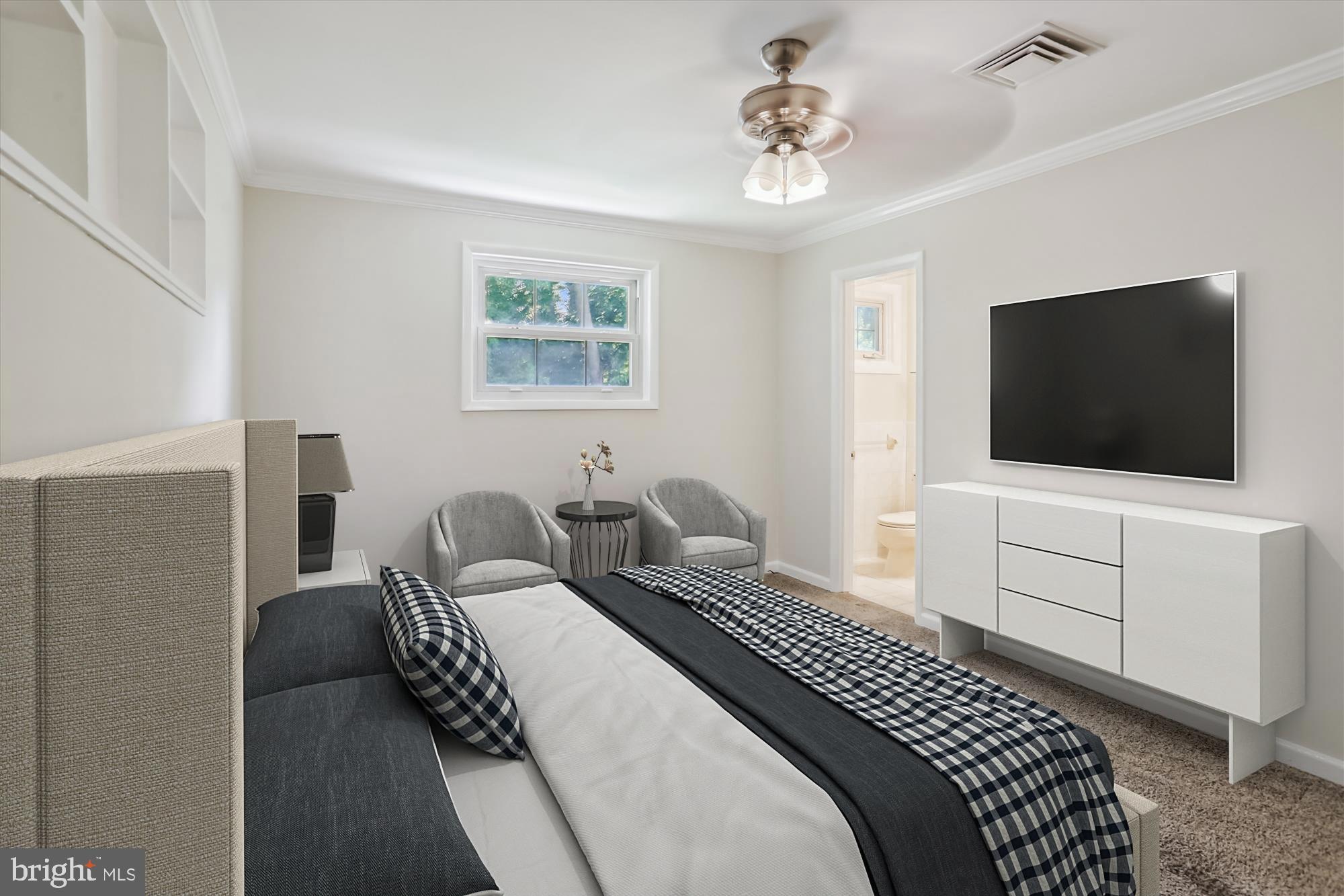 3909 Woodlawn Road Chevy Chase, MD 20815 - Photo 10 of 54 a bedroom with a bed and a flat screen tv