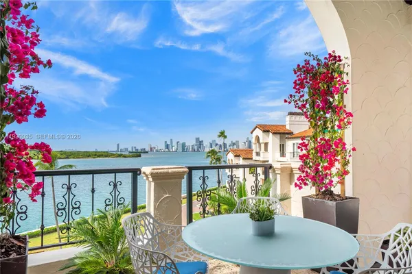 a view of a balcony with seating space