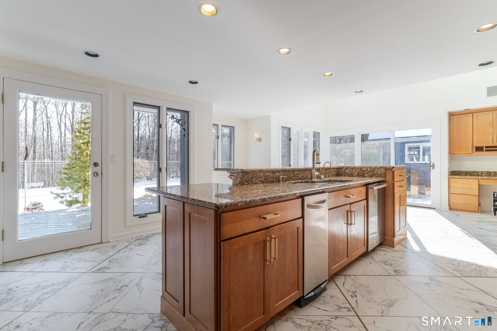 5 Mohawk Lane Woodbridge, CT 06525 - Photo 24 of 48 LIGHT AND BRIGHT KITCHEN WITH SLIDERS TO EXPANSIVE DECK