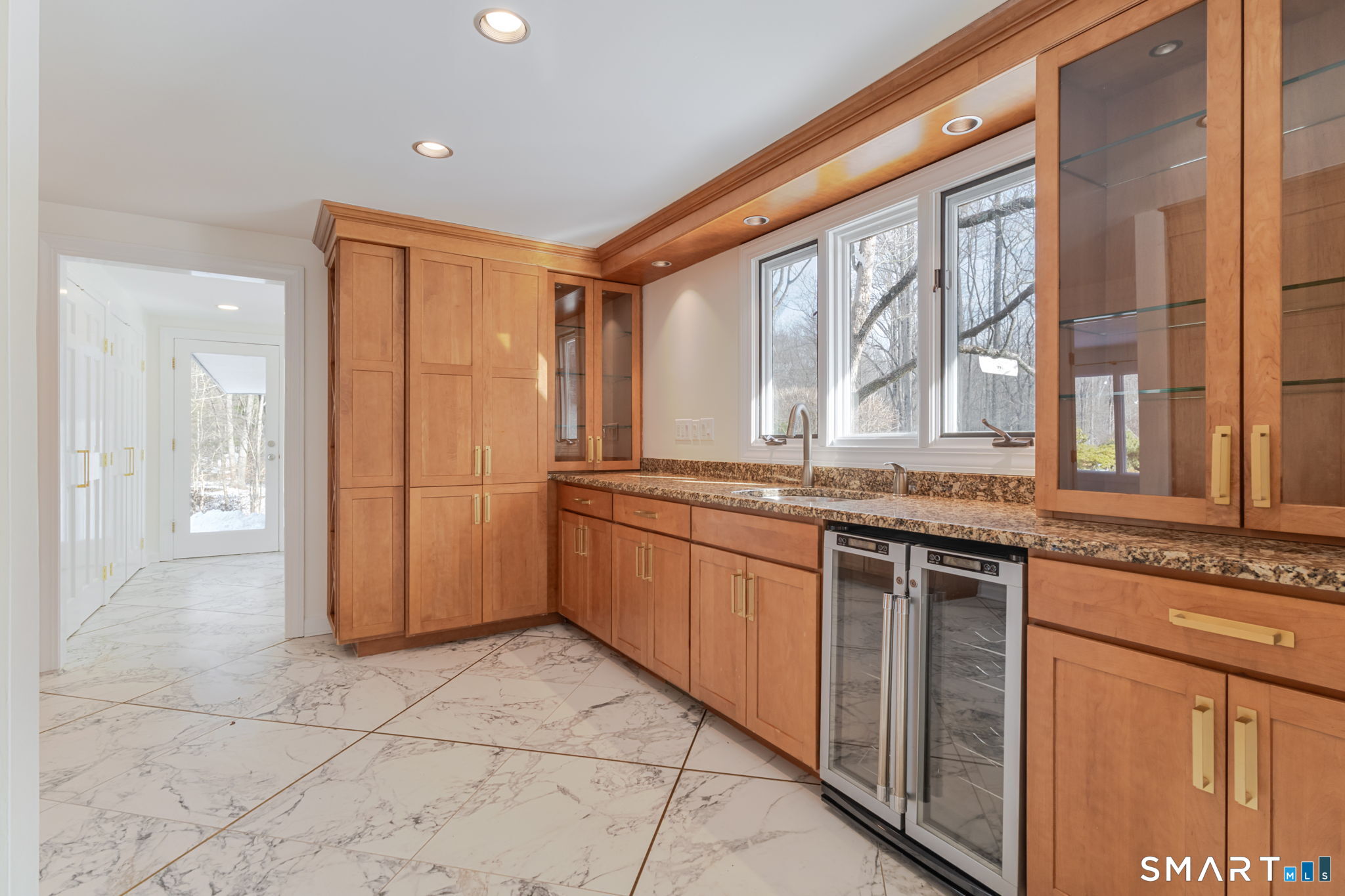 5 Mohawk Lane Woodbridge, CT 06525 - Photo 27 of 48 LARGE PANTRY WITH EXTENSIVE CABINETS, WET BAR AND BEVERAGE REFRIGERATOR