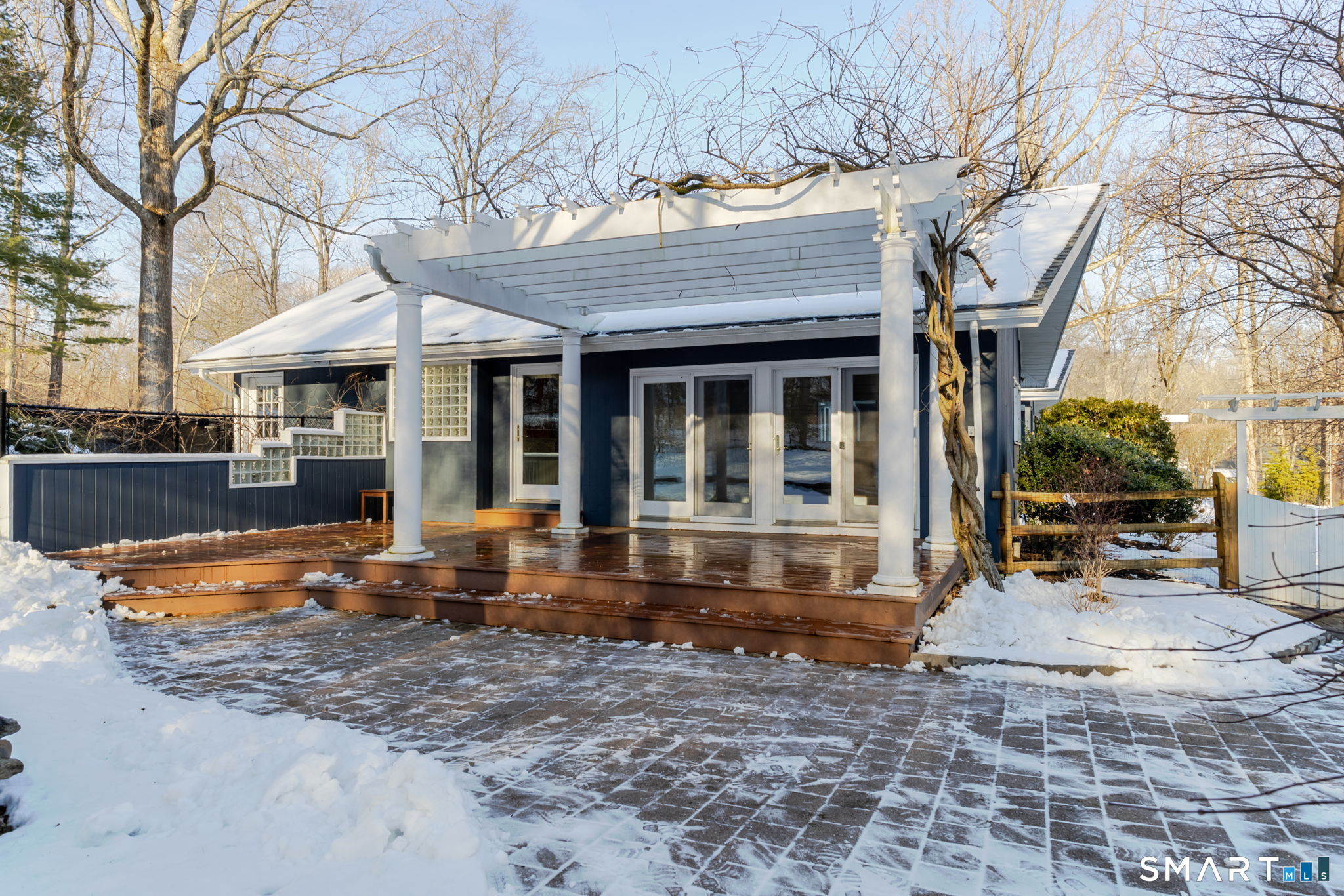 5 Mohawk Lane Woodbridge, CT 06525 - Photo 39 of 48 PRIVATE DECK WITH PERGOLA OFF PRIMARY BEDROOM OVERLOOKING POOL & BACKYARD