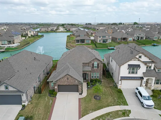 an aerial view of a house with outdoor space