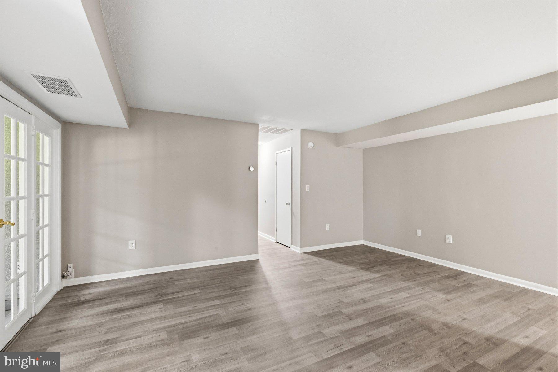 5866 Thunder Hill Road, Unit A4 Columbia, MD 21045 - Photo 8 of 21 Spacious living room with hardwood floors