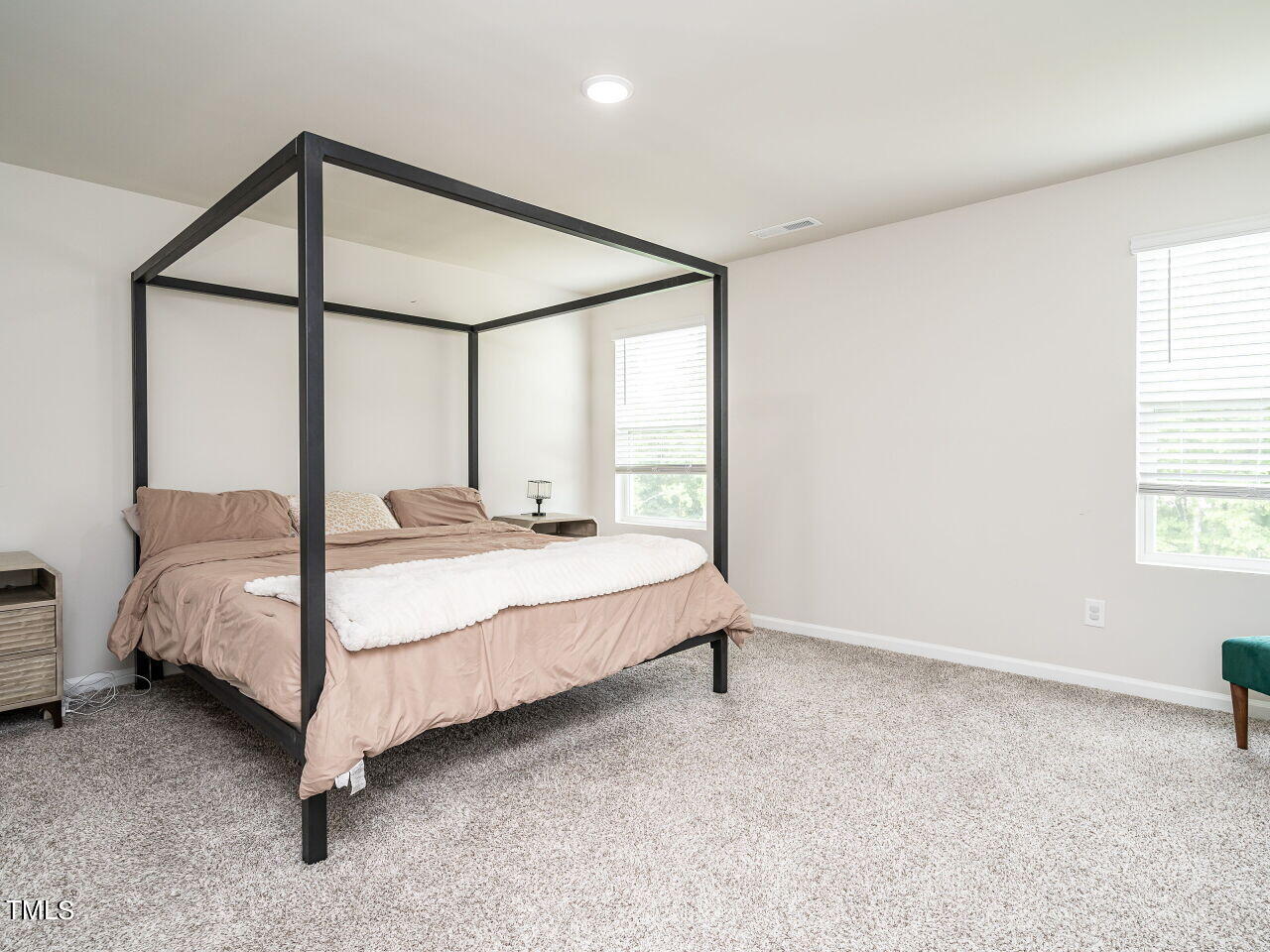 633 Embrun Run Wendell, NC 27591 - Photo 17 of 32 a bedroom with a bed and window