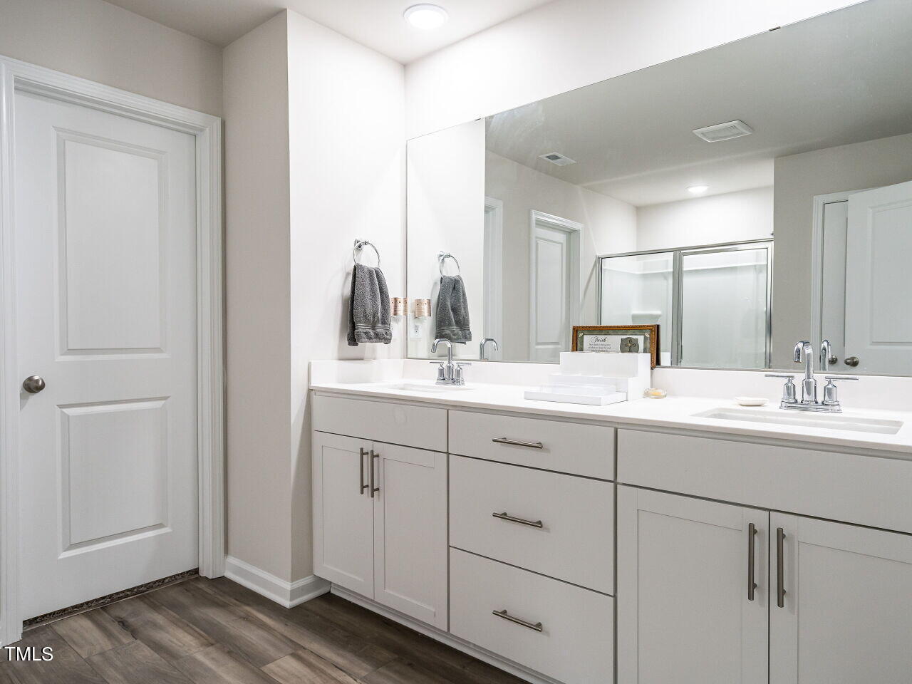633 Embrun Run Wendell, NC 27591 - Photo 19 of 32 a bathroom with double sink and a mirror