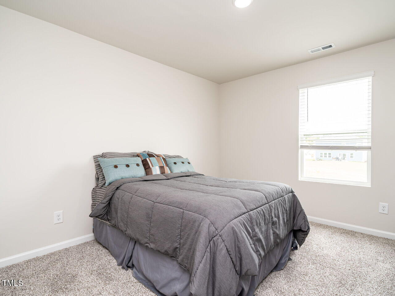 633 Embrun Run Wendell, NC 27591 - Photo 22 of 32 a bedroom with a bed and a window