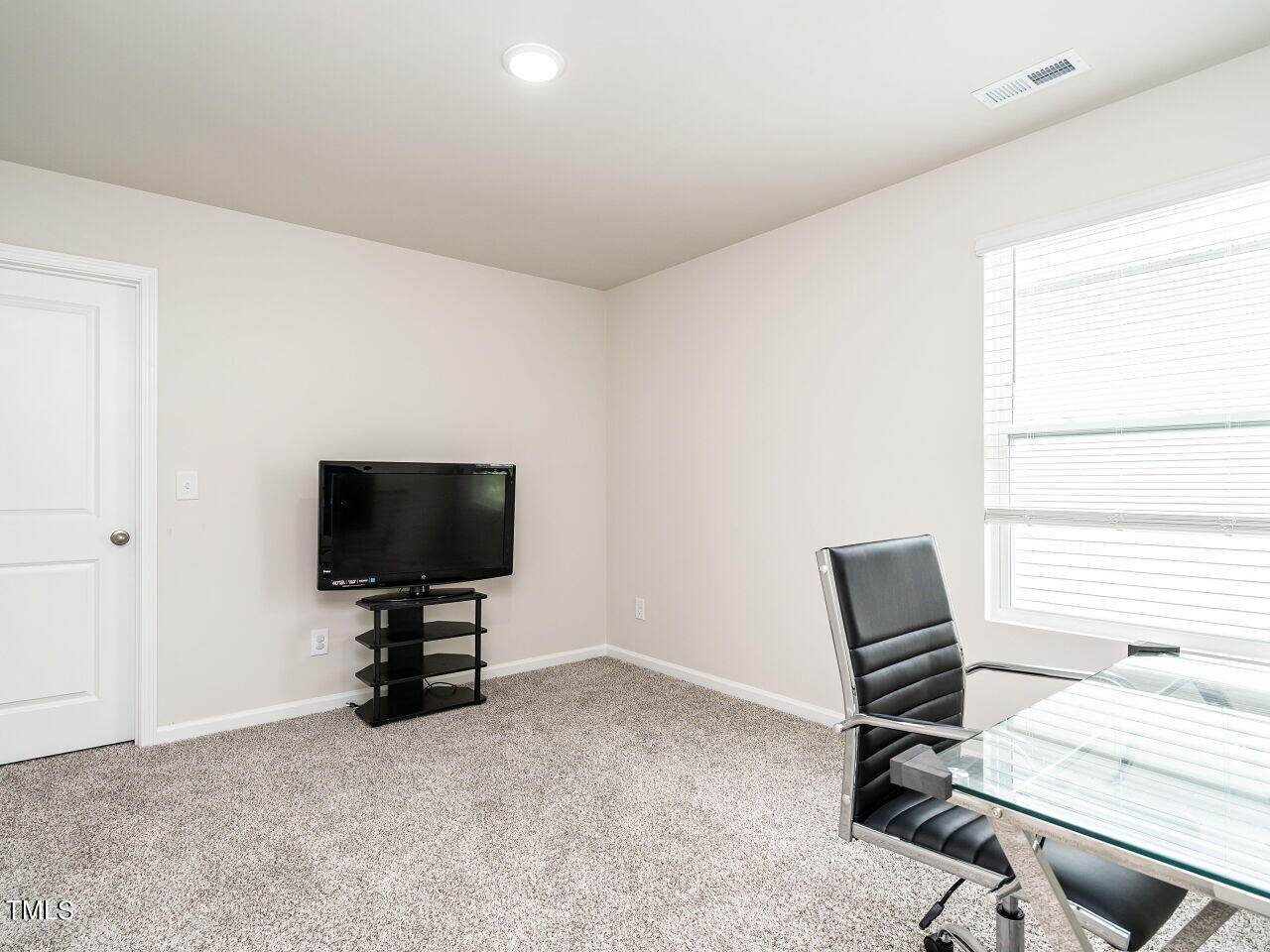 633 Embrun Run Wendell, NC 27591 - Photo 23 of 32 a view of a workspace with furniture and a window
