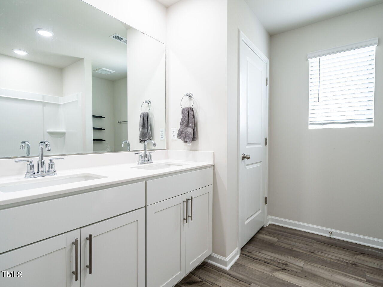 633 Embrun Run Wendell, NC 27591 - Photo 24 of 32 a bathroom with a double vanity sink mirror and