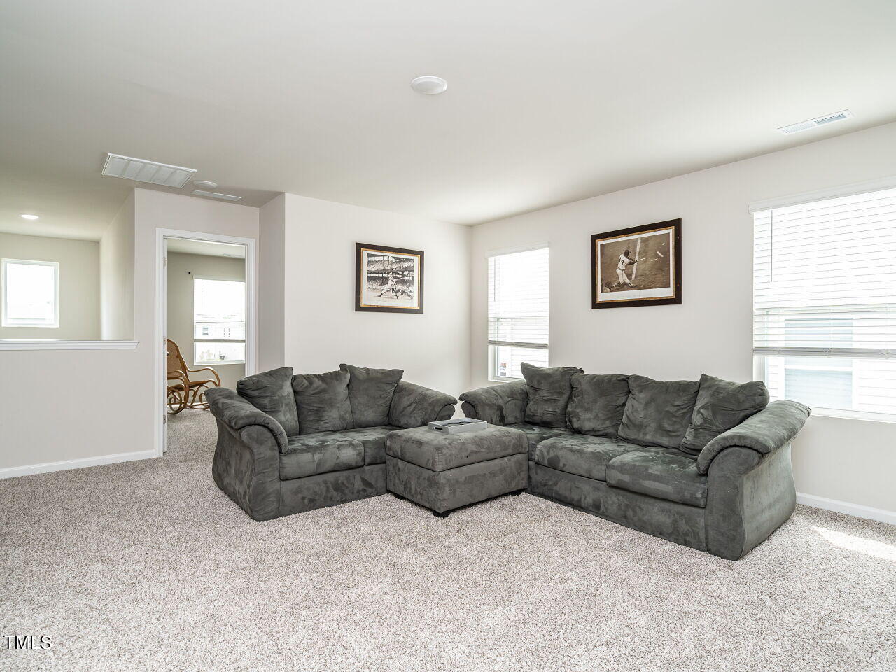 633 Embrun Run Wendell, NC 27591 - Photo 26 of 32 a living room with couches and a large window