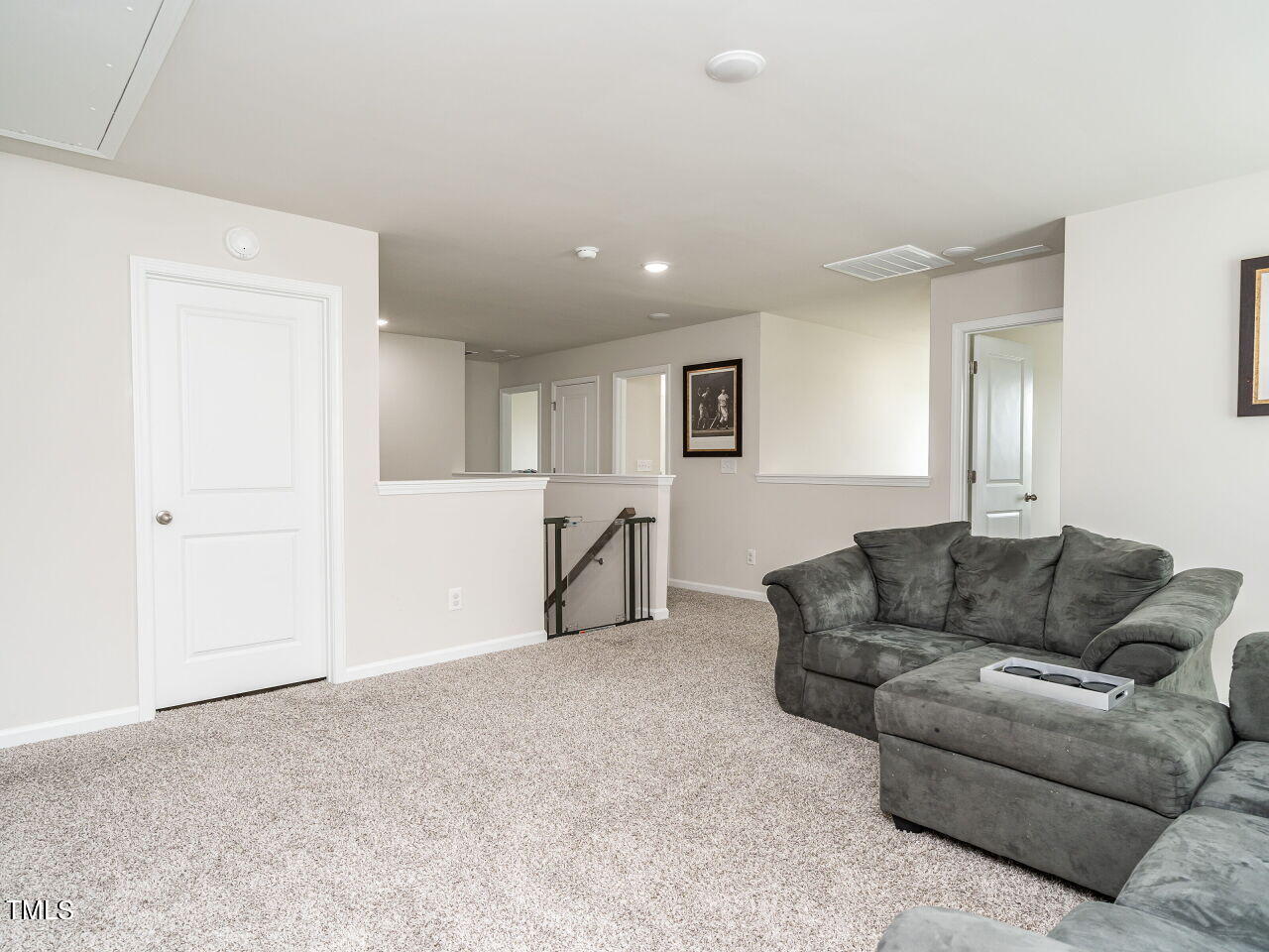 633 Embrun Run Wendell, NC 27591 - Photo 27 of 32 a living room with furniture and a couch