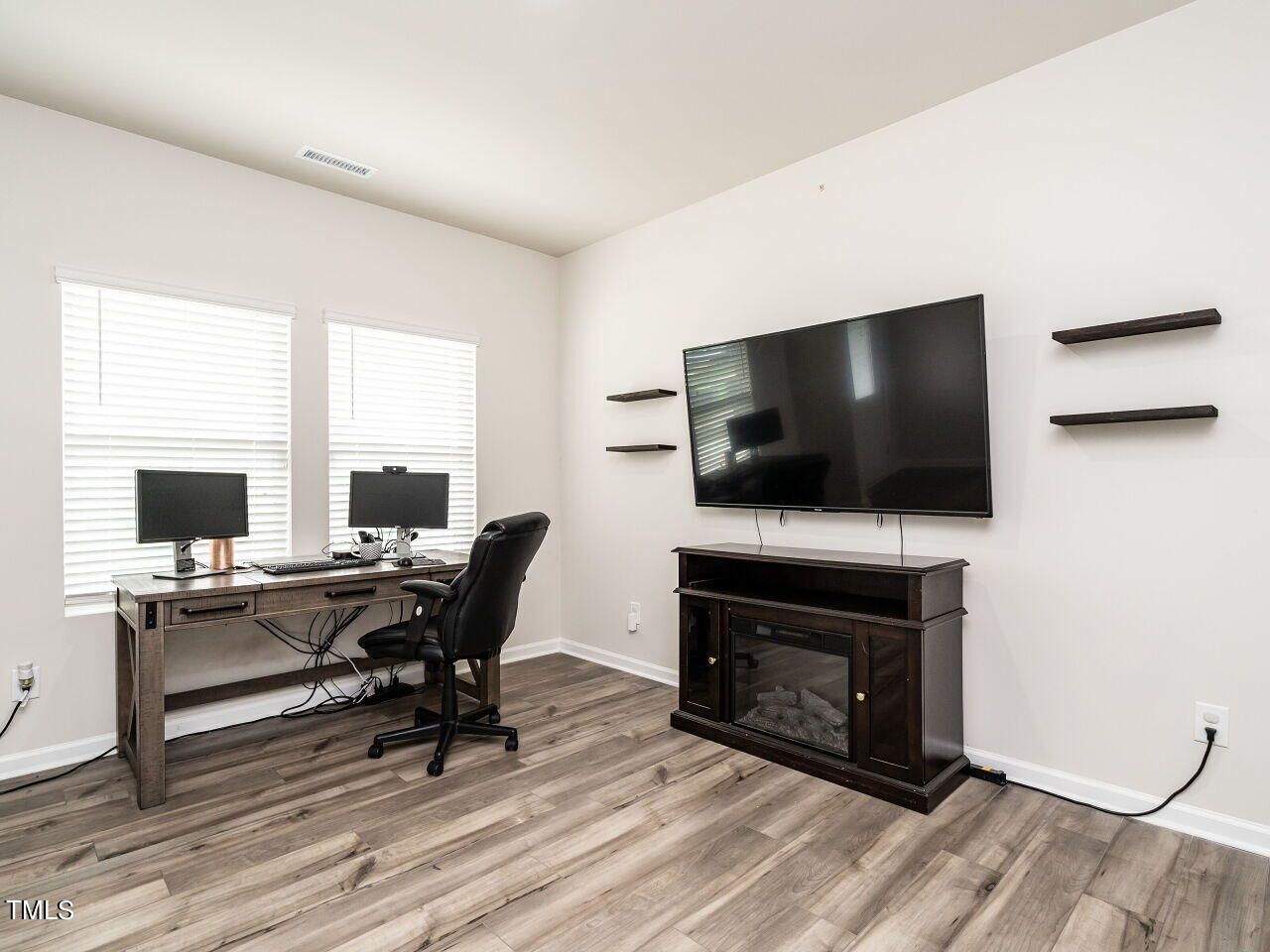 633 Embrun Run Wendell, NC 27591 - Photo 3 of 32 a living room with furniture and a flat screen tv