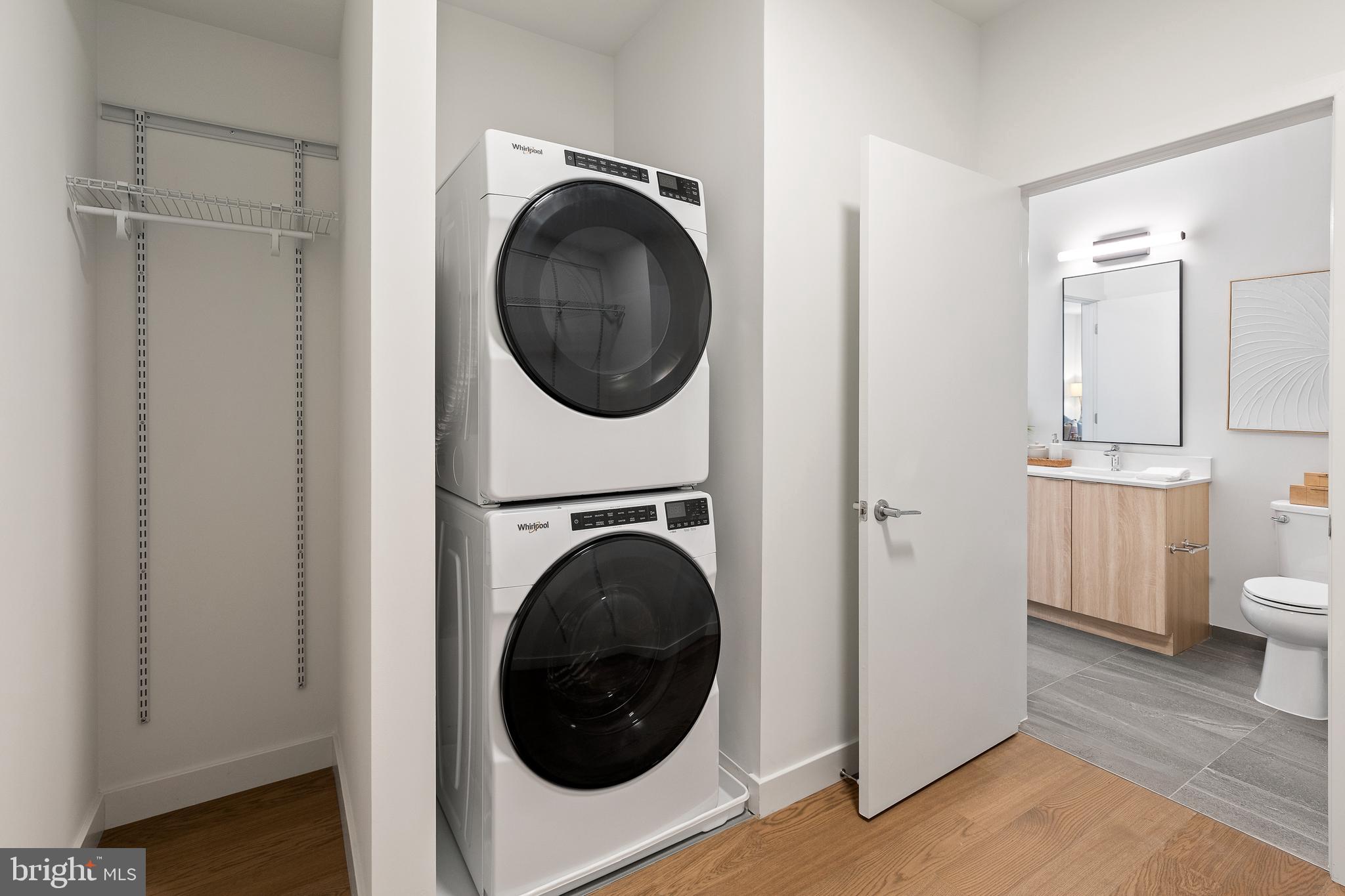 7175 12th Street Northwest, Unit 405 Washington, DC 20012 - Photo 12 of 63 a view of a hallway with washer and dryer