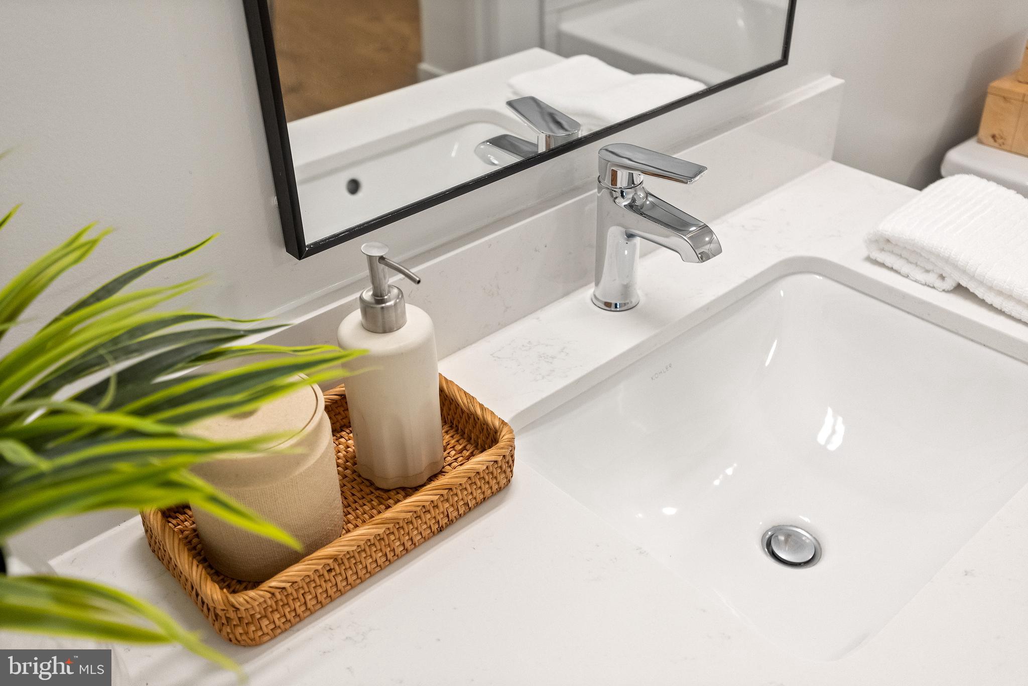 7175 12th Street Northwest, Unit 405 Washington, DC 20012 - Photo 15 of 63 a bathroom with a sink and mirror