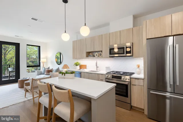 a kitchen with a refrigerator a stove a sink and a refrigerator