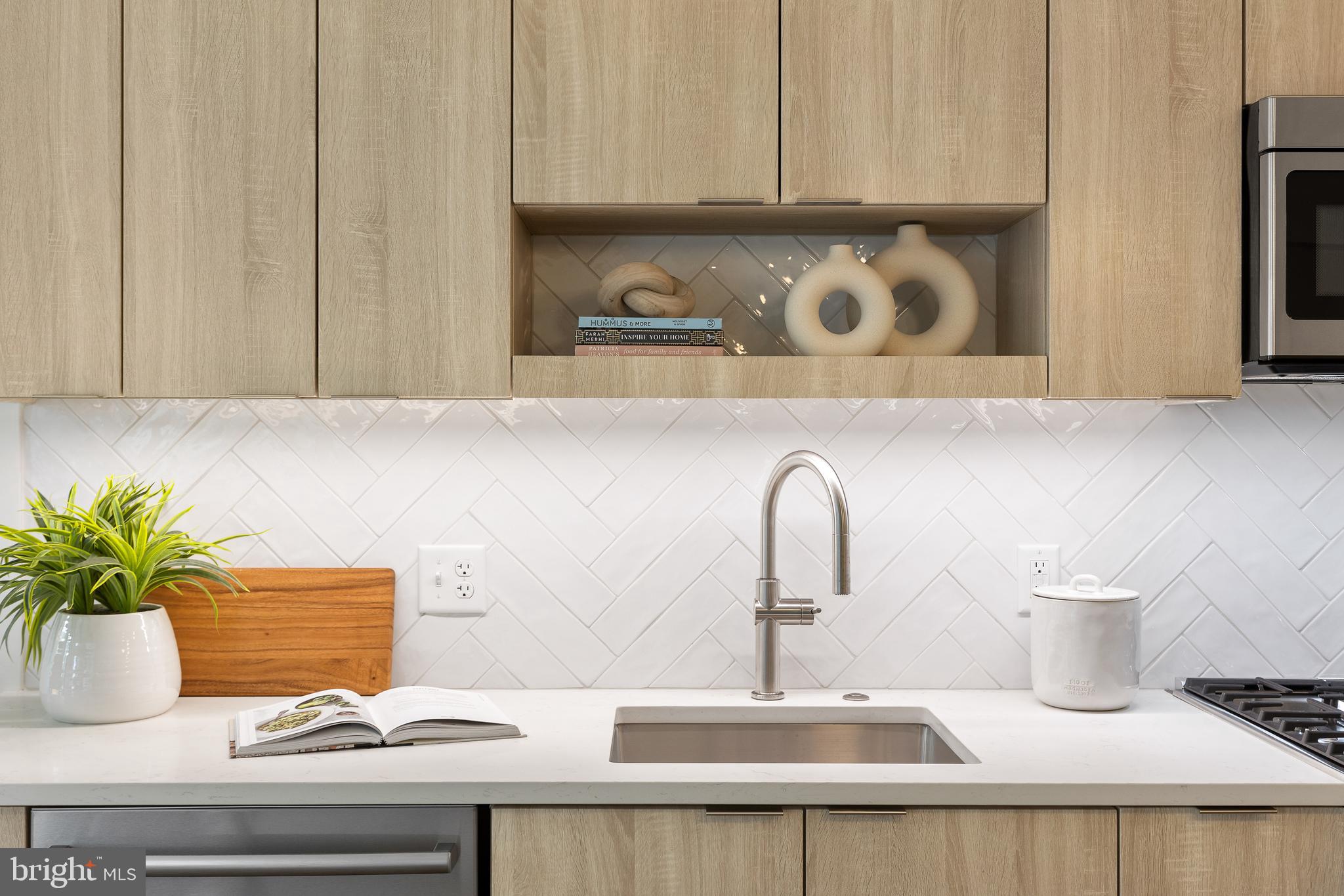 7175 12th Street Northwest, Unit 405 Washington, DC 20012 - Photo 24 of 63 a bathroom with a sink and a mirror