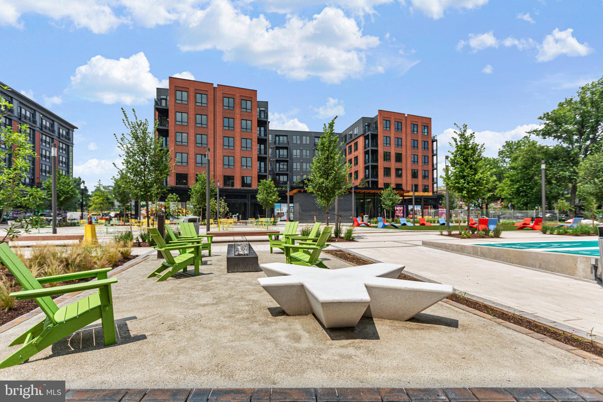 7175 12th Street Northwest, Unit 405 Washington, DC 20012 - Photo 25 of 63 a view of a patio with swimming pool and sitting area