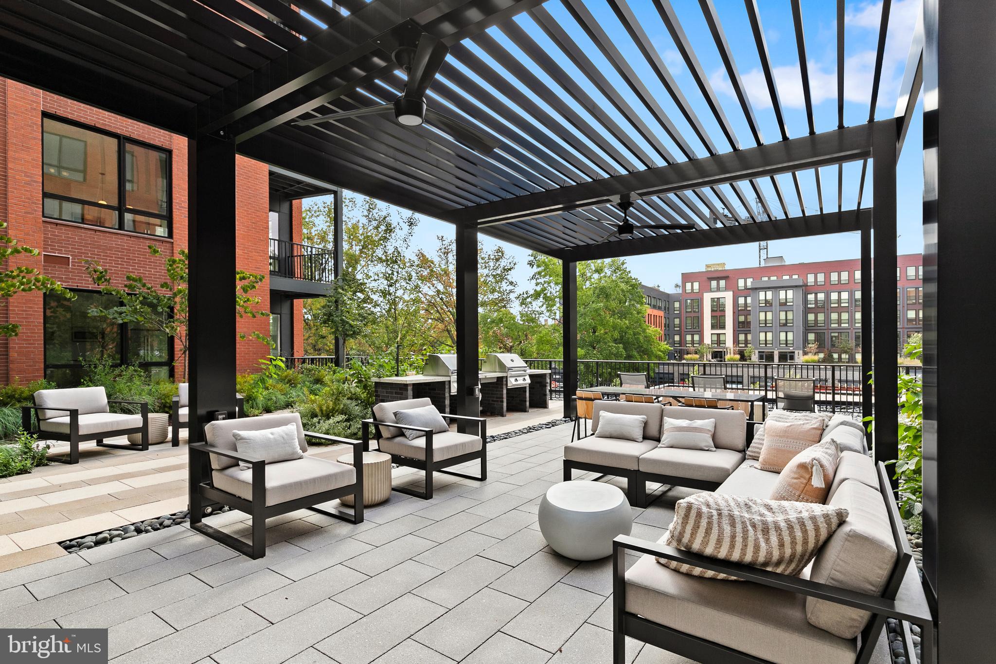 7175 12th Street Northwest, Unit 405 Washington, DC 20012 - Photo 46 of 63 a building outdoor space with patio furniture and a potted plant
