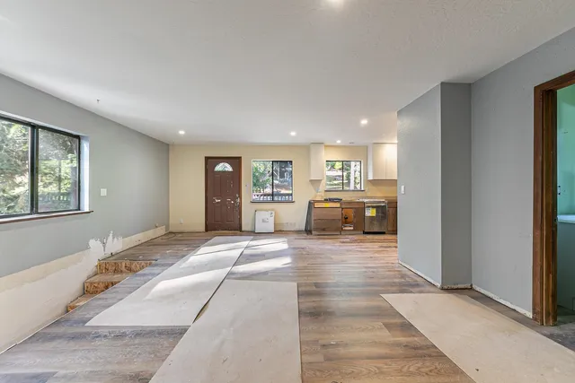 a view of a lake in middle of forest