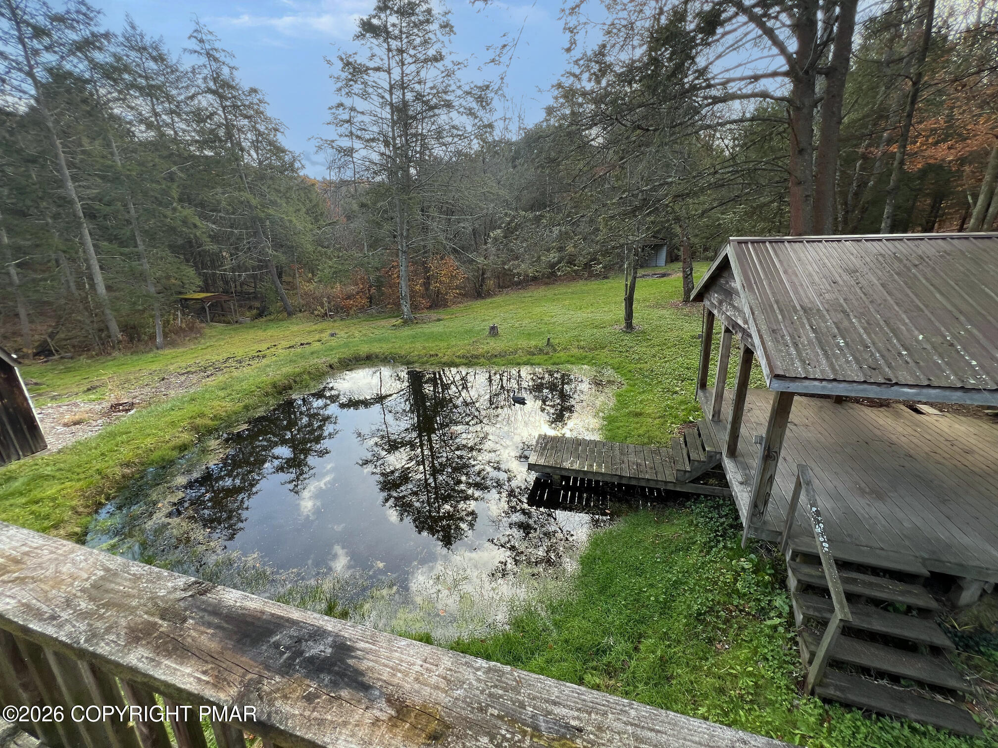 2564 Hills Creek Lake Road Wellsboro, PA 16901 - Photo 15 of 26 a view of a backyard with wooden floor